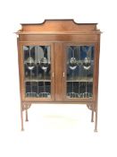 Edwardian Art Nouveau inlaid mahogany display cabinet, with raised back over two glazed doors, raise