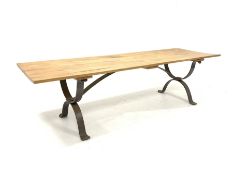 Large contemporary blacksmith made dining table, the rectangular oak top raised on wrought iron 'X'