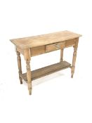 Victorian pine side table, fitted with one drawer, raised on turned supports united by under tier