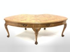 Early to mid 20th century Georgian style large walnut kidney shaped library table, the cross banded