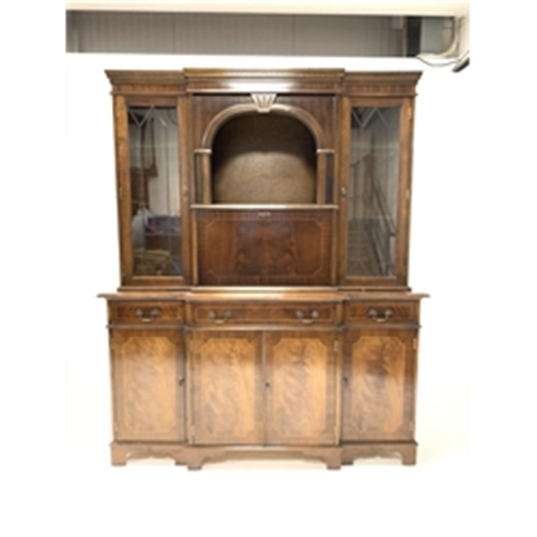 Reproduction mahogany breakfront illuminated cocktail display cabinet, with dentil cornice over glaz