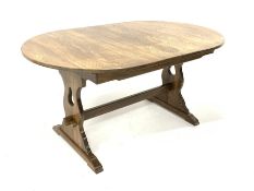 20th century oak dining table, with additional concealed leaf, raised on panel end supports and sled