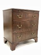 20th century George III style mahogany chest, the top with applied moulding over brushing slide and