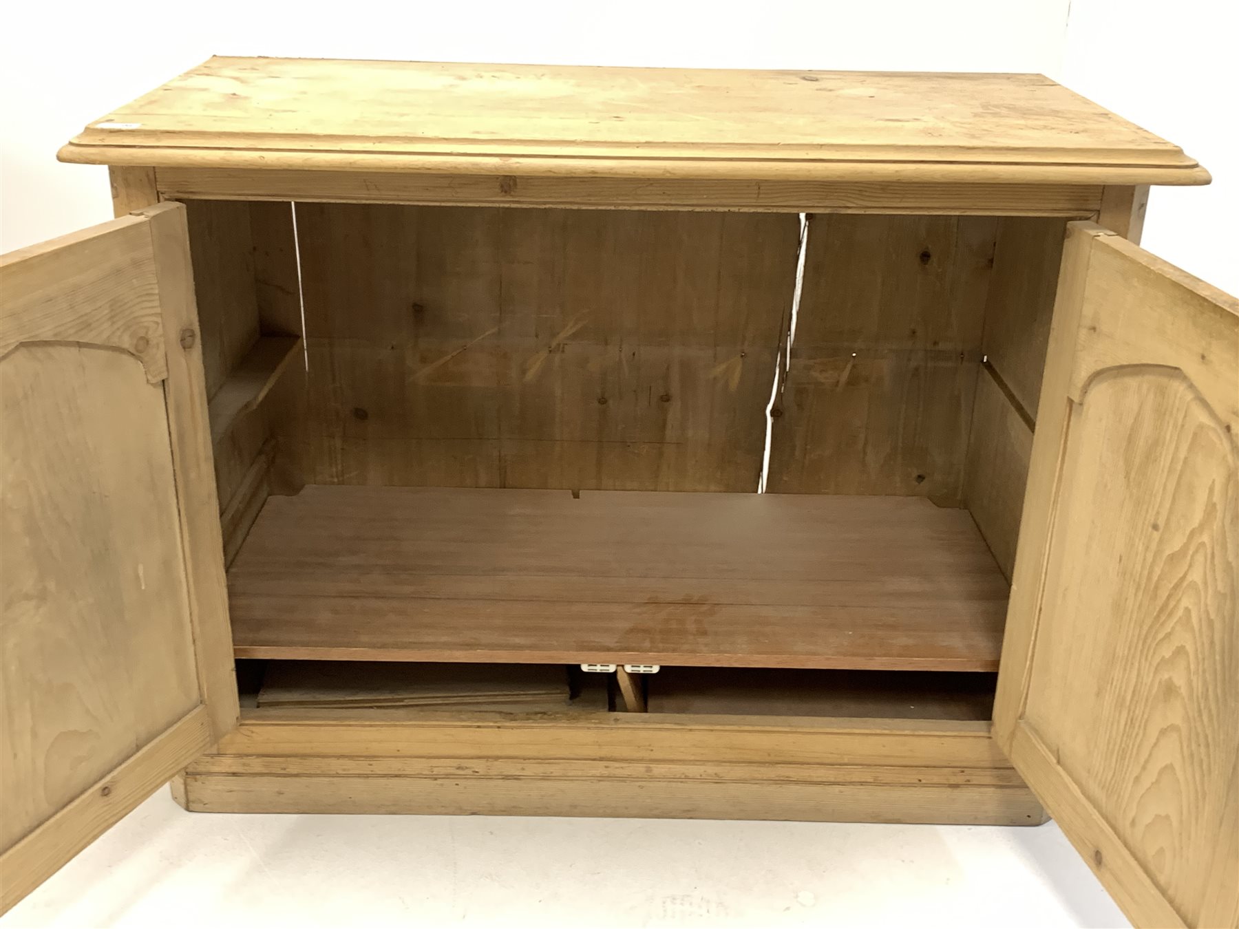 Victorian pine side cabinet, moulded top over double fielded panelled doors enclosing shelves, skirt - Image 4 of 4