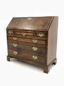 Early 19th century oak and mahogany banded bureau, fall front enclosing interior fitted with small d
