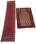 Persian runner rug, with repeating blue design on red field, (250cm x 56cm) together with a Persian