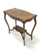 Edwardian rosewood centre table, serpentine top with canted corners, over square cabriole supports u