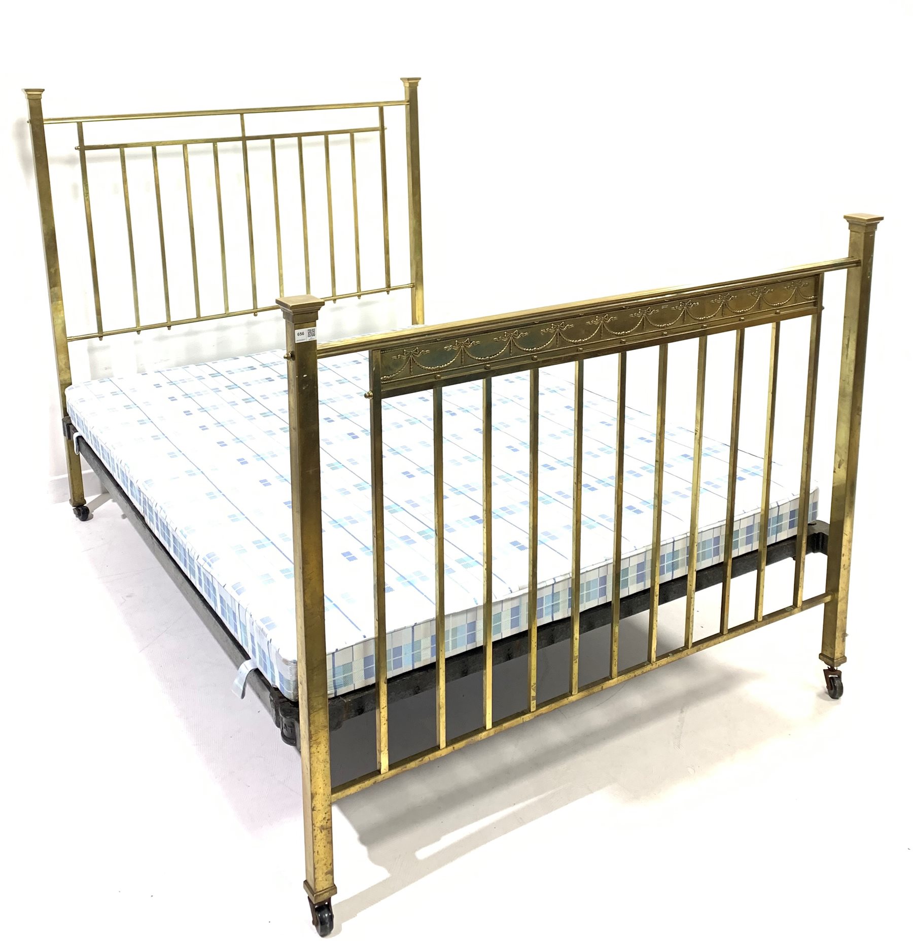 19th century brass 4'6" double bed, decorated with ribbon swags, with a later folding box base,