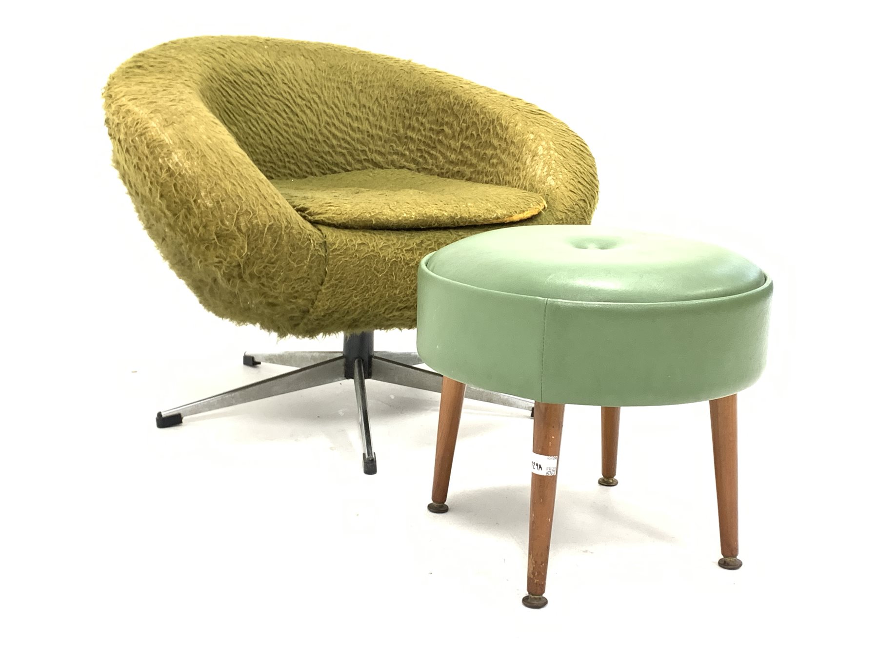 Mid 20th century swivel chair, upholstered in green faux fur, raised on chrome four point base () to