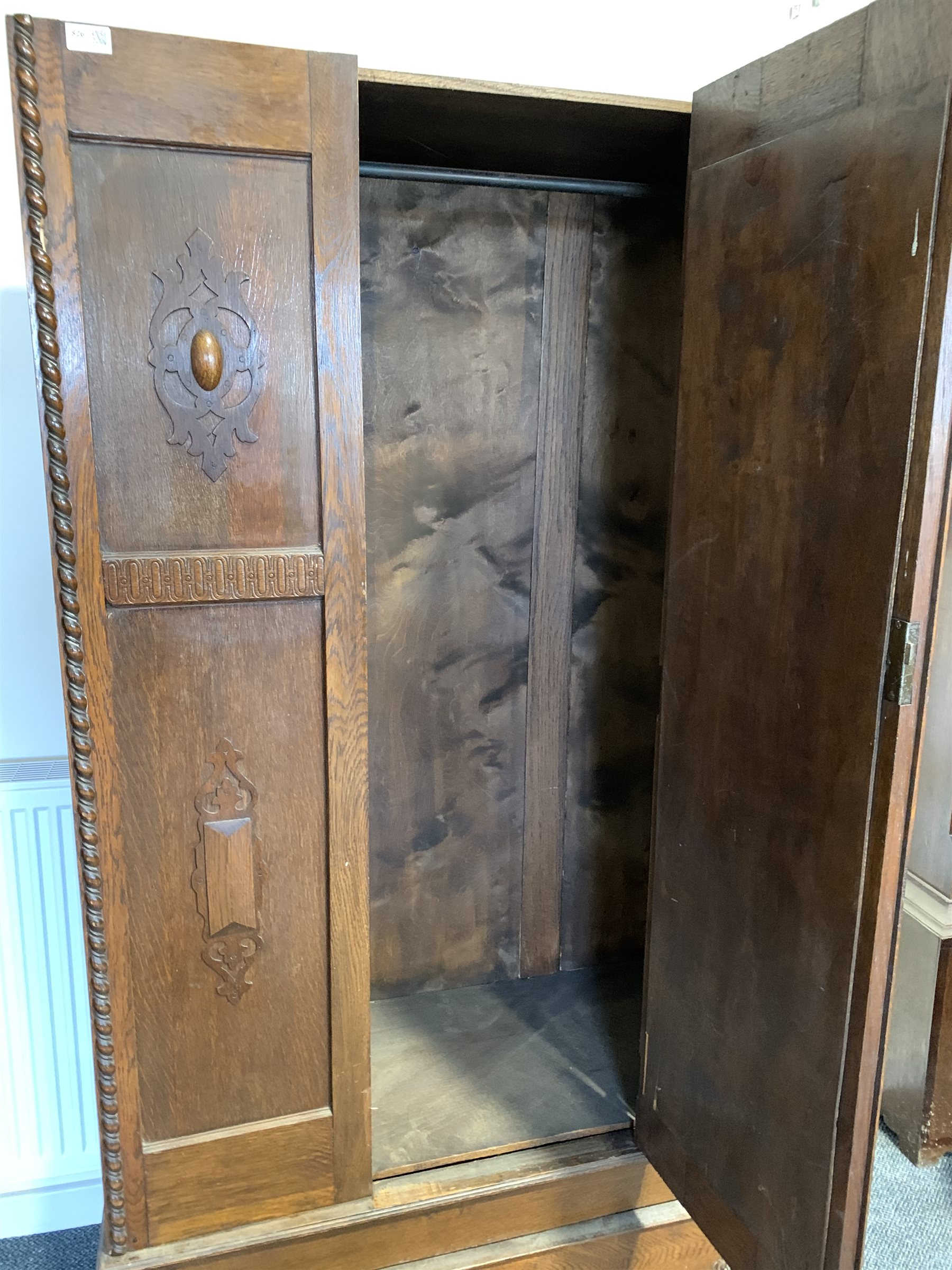 Early 20th century oak single wardrobe, with bevelled oval mirror enclosing interior fitted for hang - Image 3 of 3