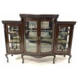 Early 20th century mahogany display cabinet, the central bowed section with bevelled glazed double d
