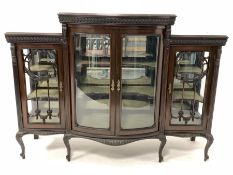 Early 20th century mahogany display cabinet, the central bowed section with bevelled glazed double d