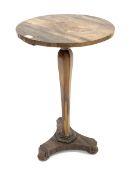 Mid 19th century rosewood lamp table, the circular top raised on a shaped and tapered octagonal colu