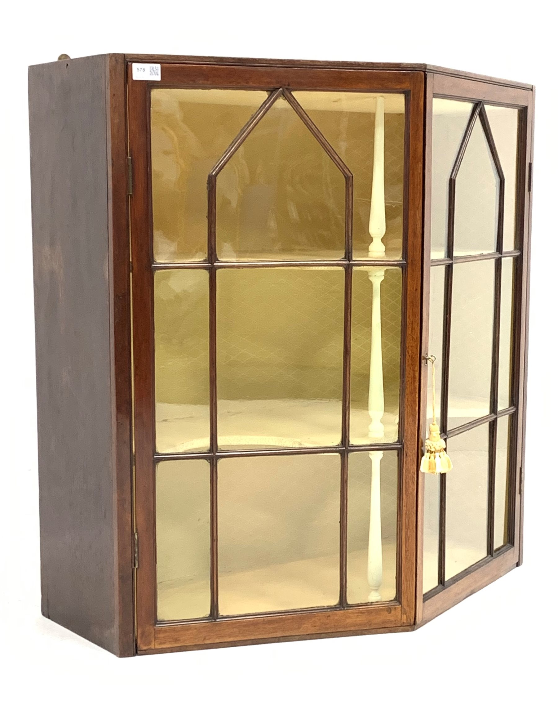 Mid 19th century oak wall hanging display cabinet, canted front with double astragal glazed doors en