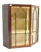 Mid 19th century oak wall hanging display cabinet, canted front with double astragal glazed doors en