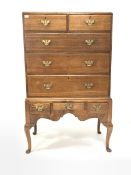 Mid 19th century oak chest on stand, the top section fitted with two short and three long graduated