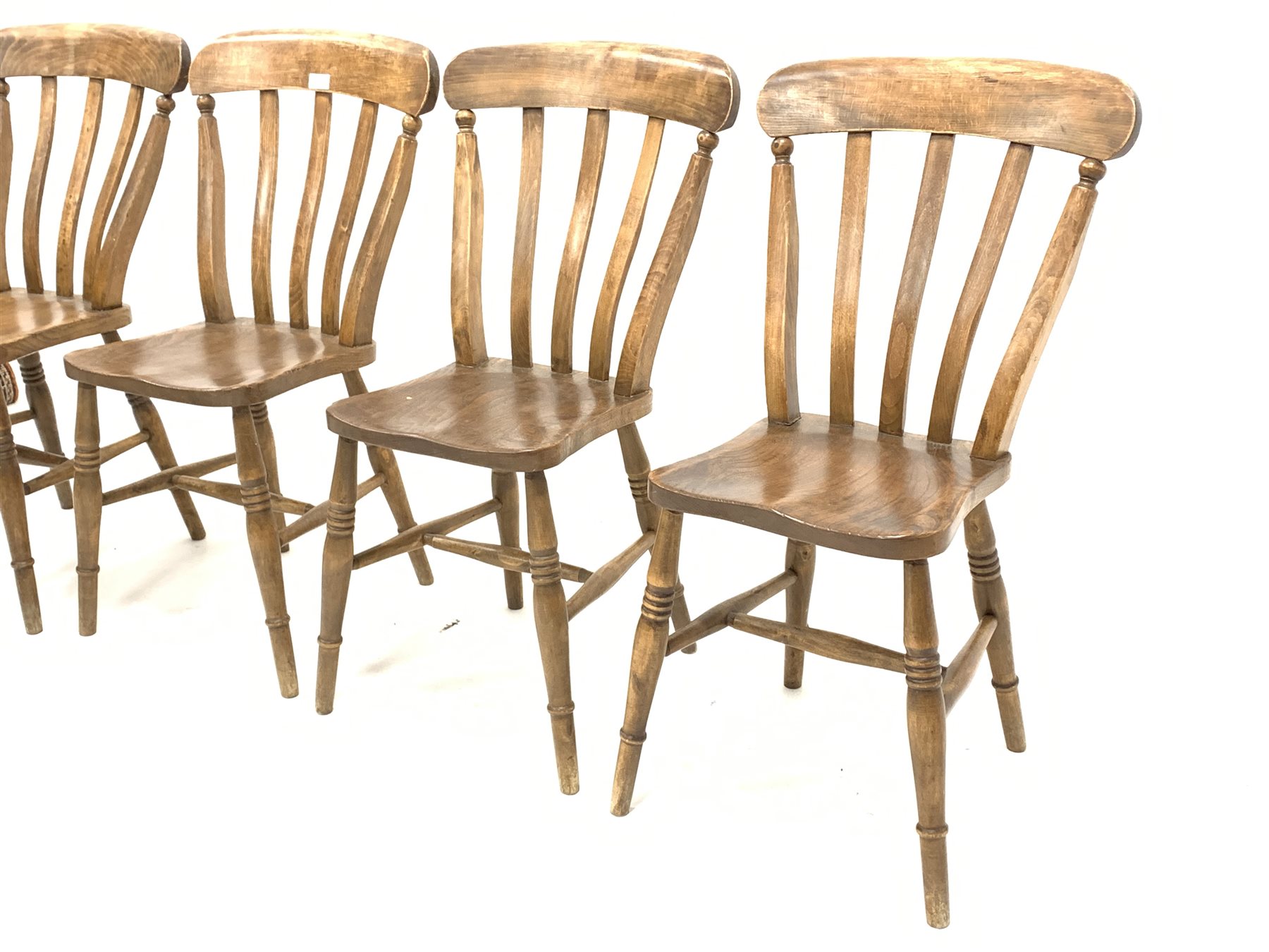 Set of four country elm and beech dining chairs, with shaped seats raised on ring turned supports an - Image 2 of 3