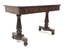 William IV rosewood library table, the well figured rectangular top over two drawers, raised on two