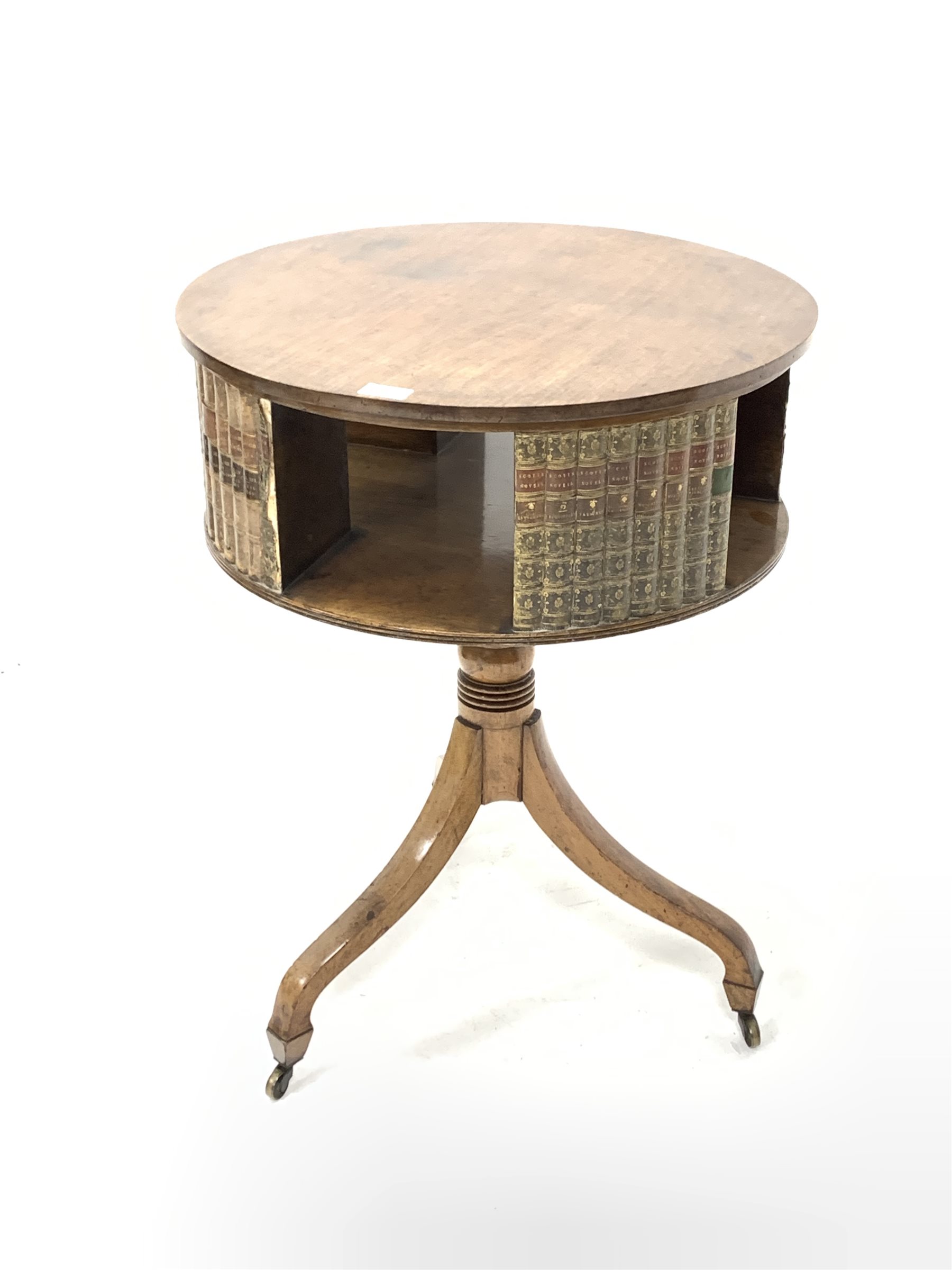 20th century Regency design mahogany drum table, the circular revolving top having faux books and re