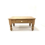 Contemporary pine coffee table fitted with one drawer and raised on turned supports