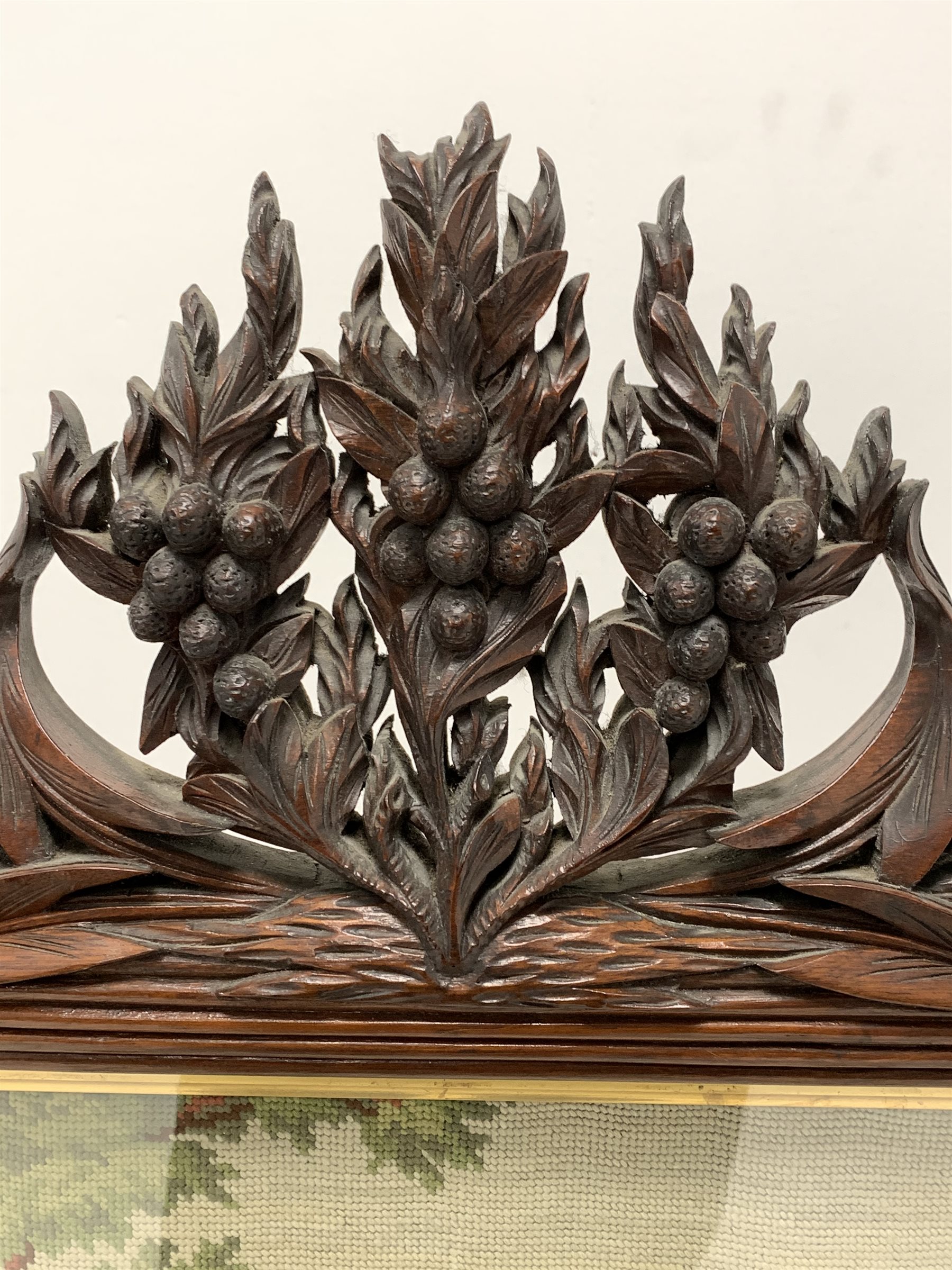 Victorian mahogany fire screen, reeded frame with needlework panel surmounted by floral carved pedim - Image 2 of 3