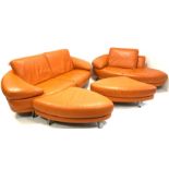 Contemporary Italian lounge suite, comprised of an orange leather two seat sofa, raised on brushed m