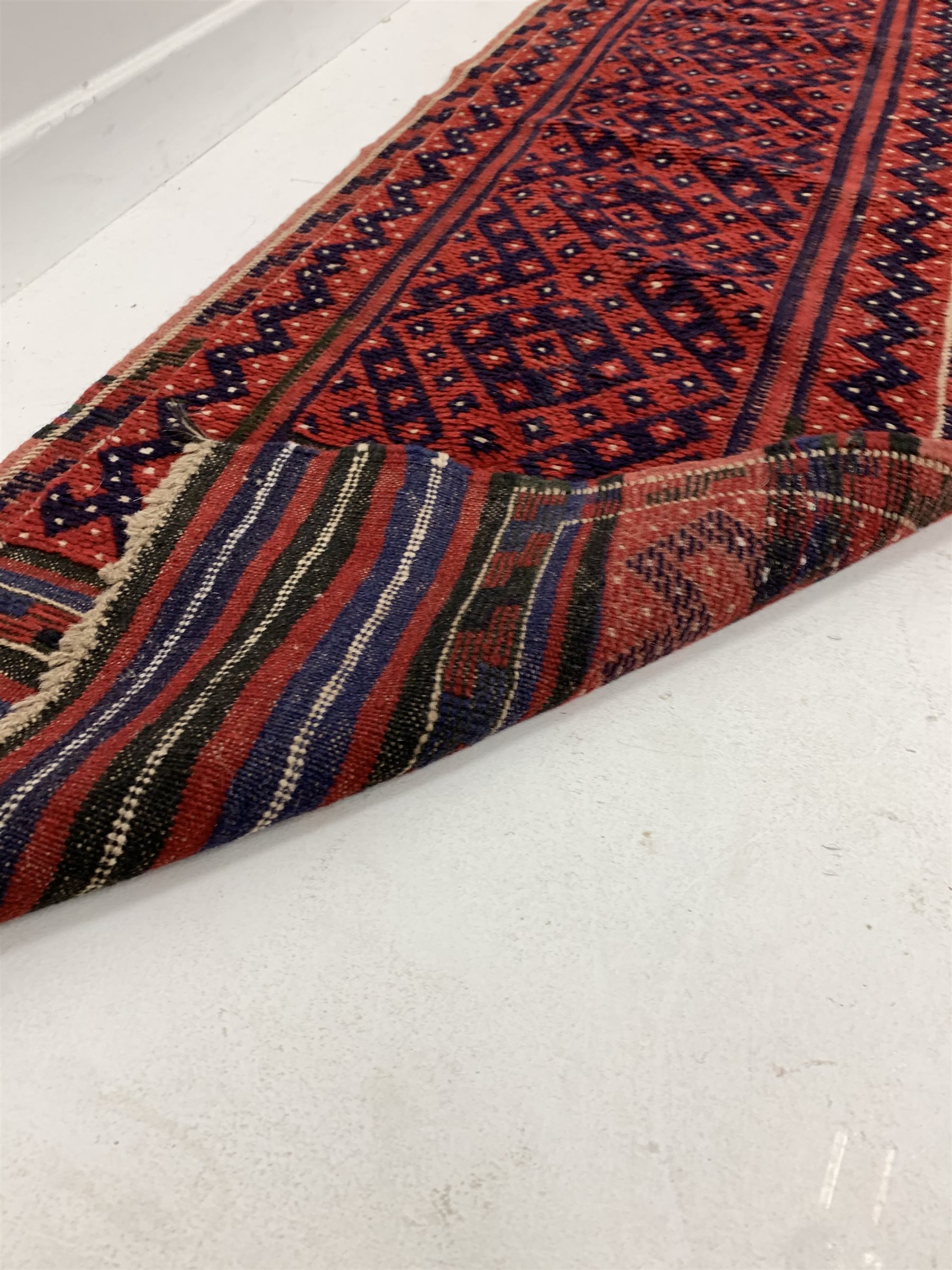 Persian runner rug, with repeating blue design on red field, (250cm x 56cm) together with a Persian - Image 3 of 5