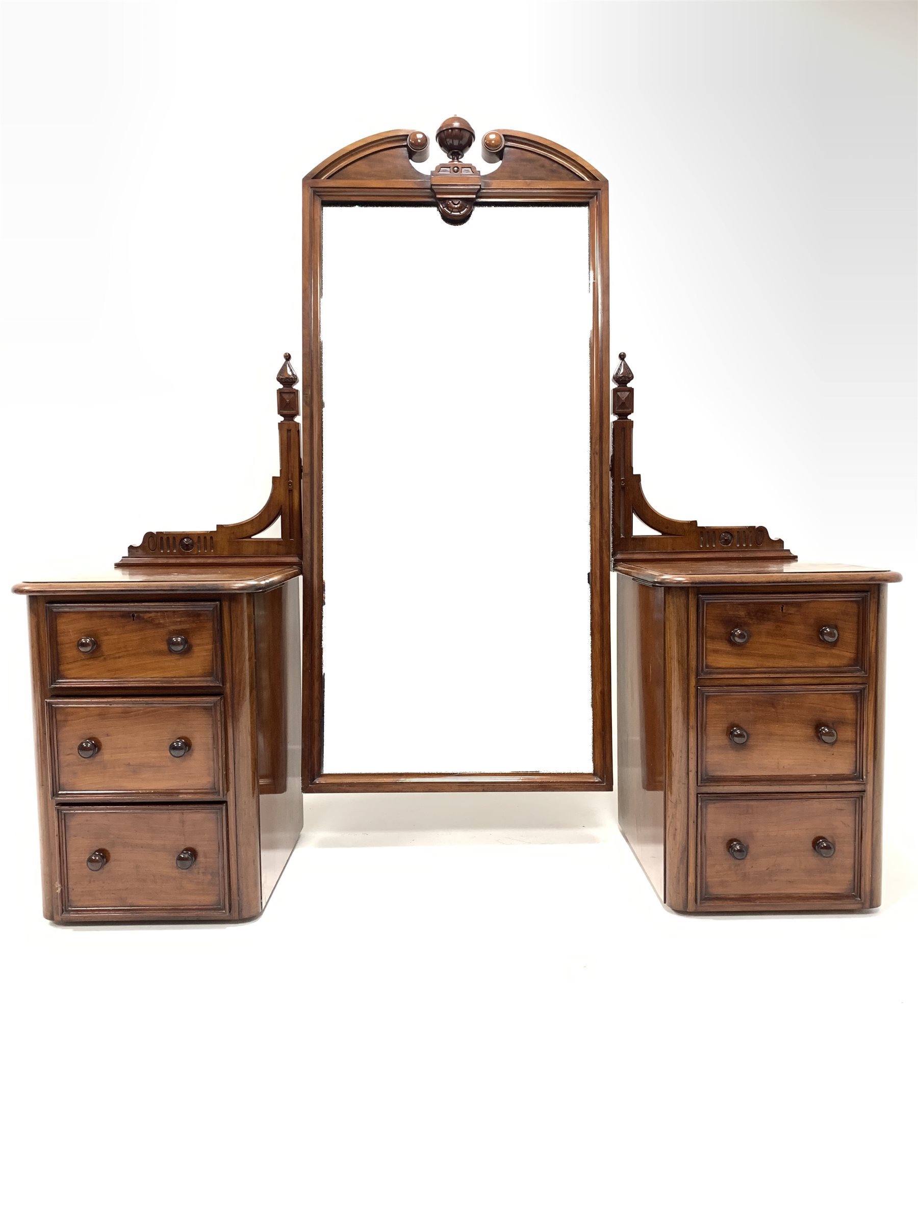 Victorian mahogany pedestal dressing table, the swing mirror with broken arch pediment, raised on tw