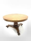 Mid 19th century burr hardwood breakfast table, circular tilt top raised on a panelled baluster pede