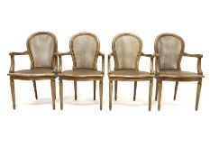 Set four French style berg�re open armchairs, moulded beech frames, curved cane work backs and serpe