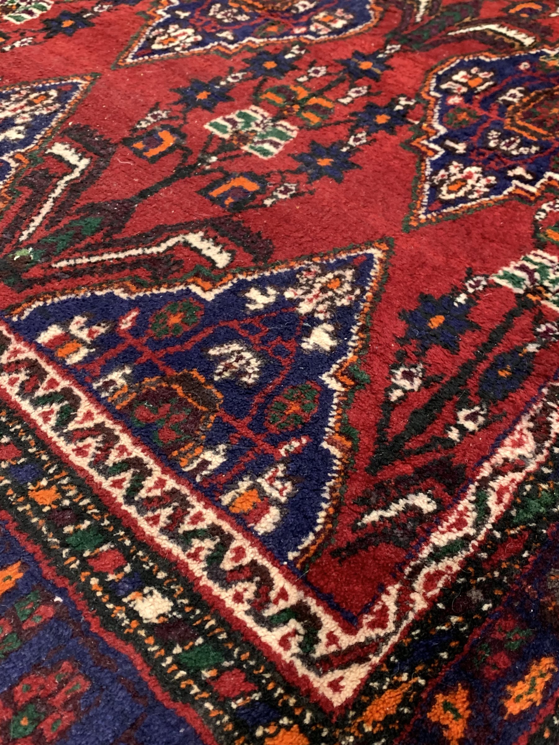 Iranian Neynz rug, red ground with multiple stylised lozenge decorated field - Image 2 of 3