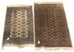 Persian design Bokhara rug, gul motif on beige field enclosed by multi line border (96cm x 160cm) to