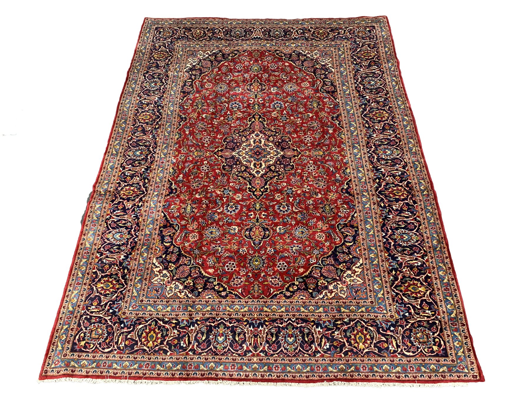 Persian fine Kashan carpet, blue and ivory medallion on red field, enclosed by triple guarded border