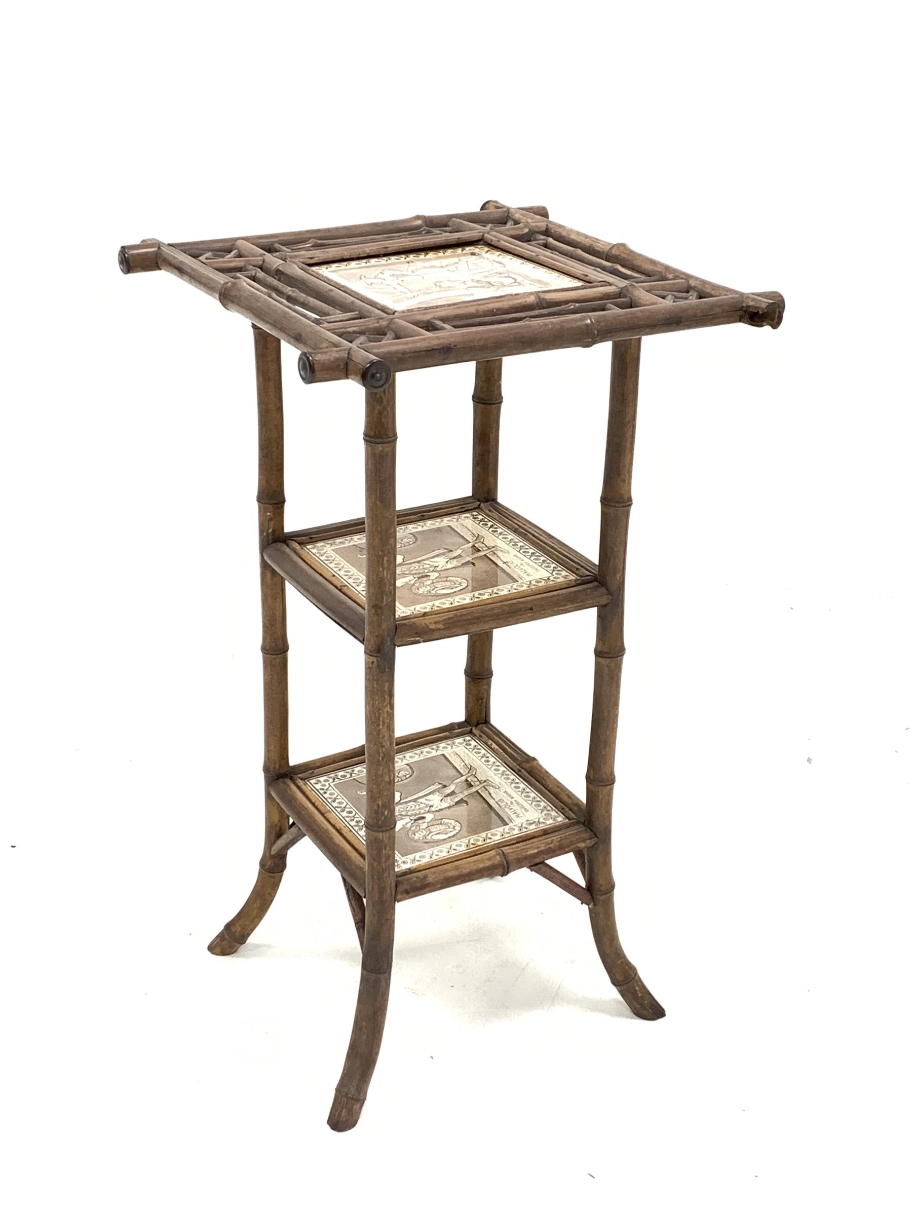 Victorian Aesthetic style bamboo occasional table, with three tiers each inset with a tile depicting