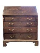 Early 19th century oak bureau, fall front revealing fitted interior over four long graduated drawers