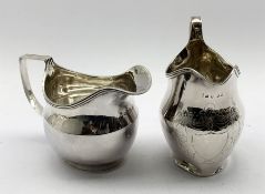 George III silver cream jug with an engraved shield shape cartouche and reeded loop handle London 18