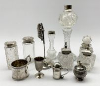 Silver paper spike with an attached climbing bear, five silver mounted glass dressing table jars, p