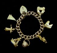 9ct gold curb chain bracelet, with heart locket and seven 9ct gold charms including sailing boat, da