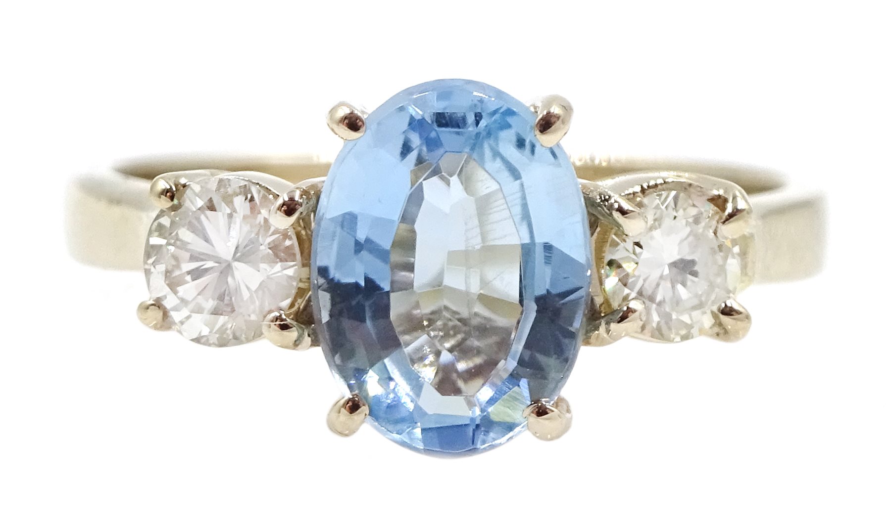 18ct gold three stone oval aquamarine and round brilliant cut diamond ring, hallmarked, aquamarine a