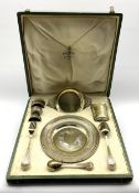 French silver and parcel gilt christening set comprising a circular plate with chased leaf decoratio