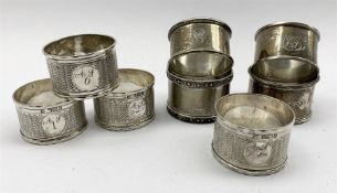 Three engraved and numbered late Victorian silver serviette rings Sheffield 1892, another very simil