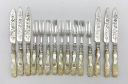 Set of six Edwardian silver bladed dessert knives with mother of pearl handles engraved with a monog