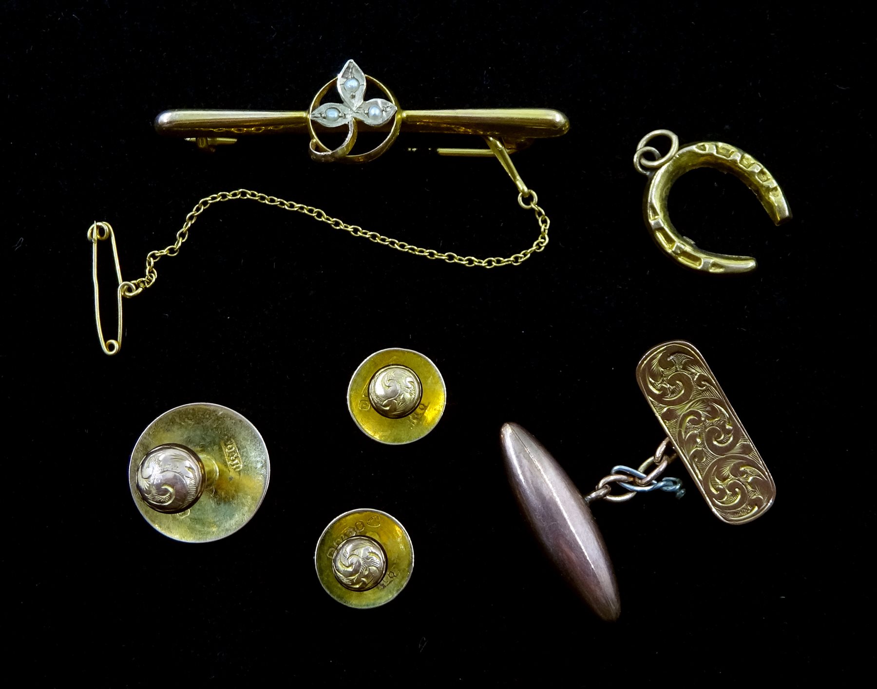 Three gold shirt studs, gold seed pearl bar brooch, horseshoe pendant and single cufflink, all 9ct s