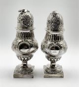 Pair of vase shape silver sugar casters, the two cartouches engraved with a crest and monogram, embo