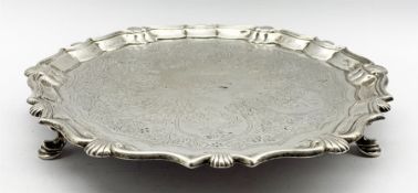 George II small silver circular salver engraved with a crest and later engraved decoration within a