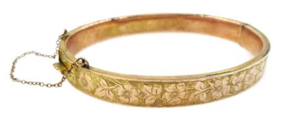 Early 20th century rose gold hinged bangle, engraved floral and foliate decoration by S Ward & Sons,