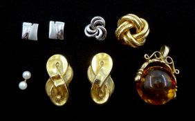 Two pairs of gold stud earrings, gold amber swivel pendant and three single stud earrings, all 9ct s