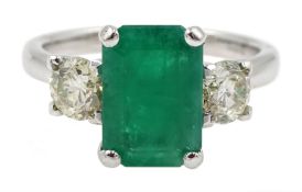 18ct white gold three stone emerald cut emerald and round brilliant cut diamond ring, emerald 1.92 c