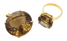 Gold circular smoky quartz ring and a smoky quartz gold pendant, both 17ct