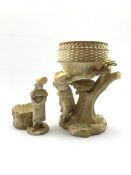 Royal Worcester blush ivory jardini�re, the basket on figural support depicting young girl beside a